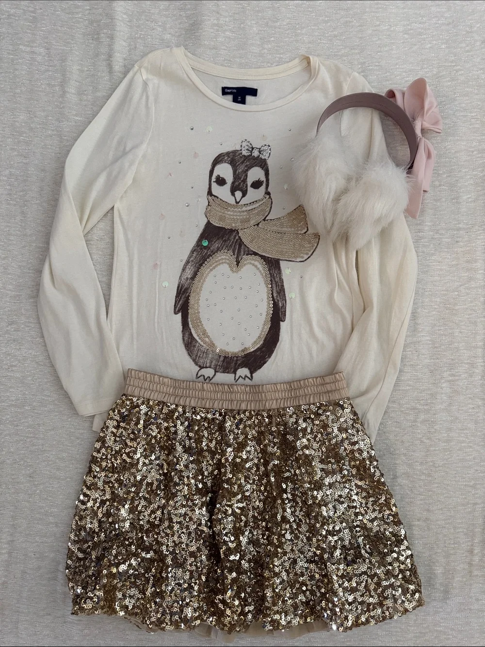 GAP Kids Cream Tee with holiday penguin paired with gold sequin skirt
